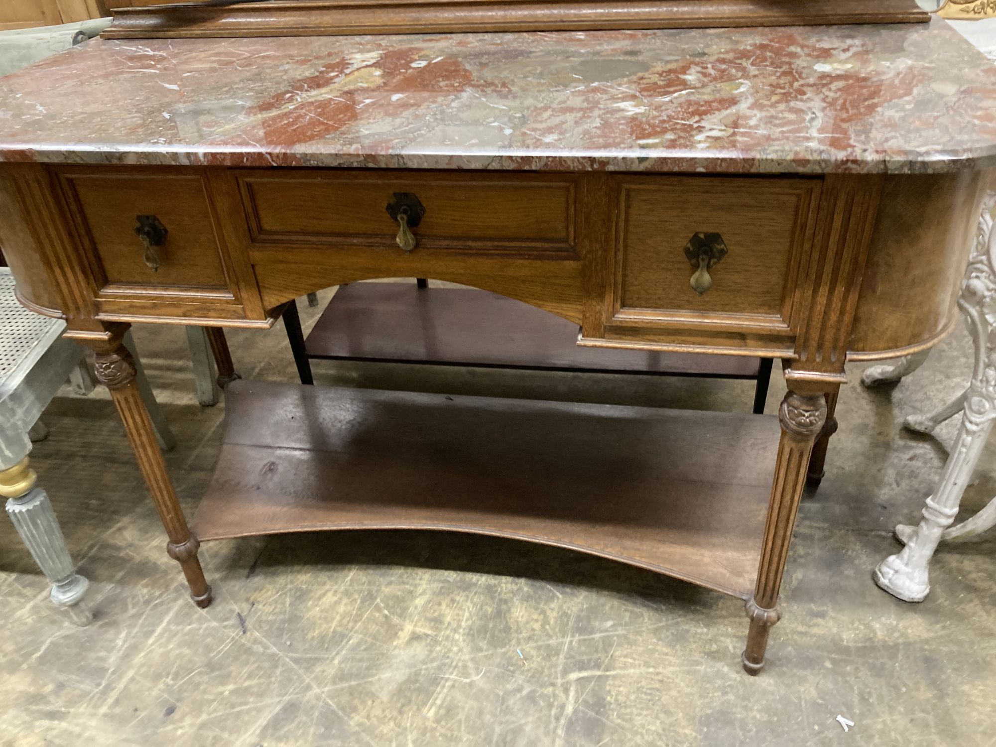 An early 20th century French marble topped mirror back dressing table, length 127cm, depth 55cm, height 182cm